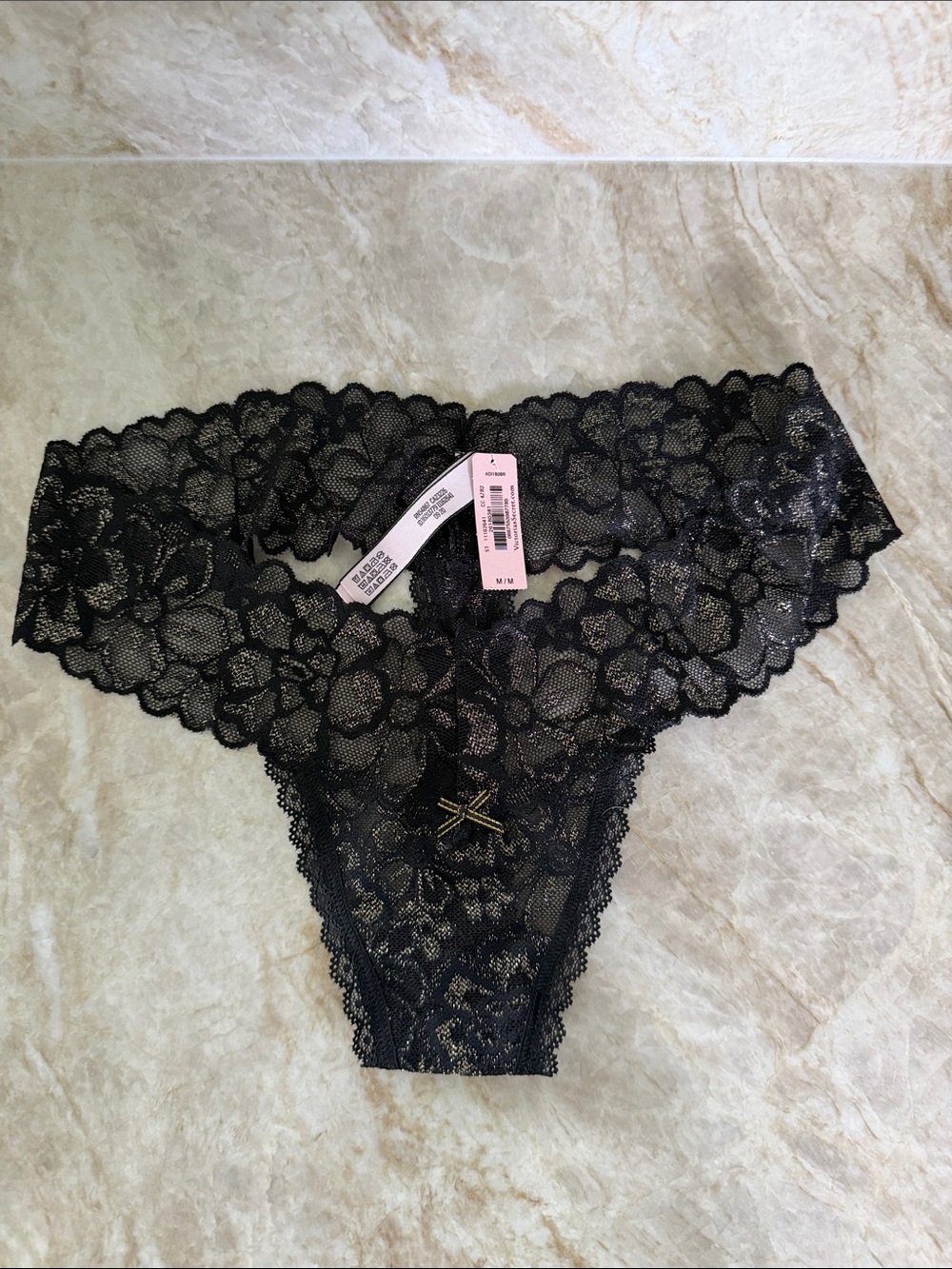 BRAND NEW WITH TAGS! Victoria's Secret Black Floral Lace Cheeky Thong. Size: M